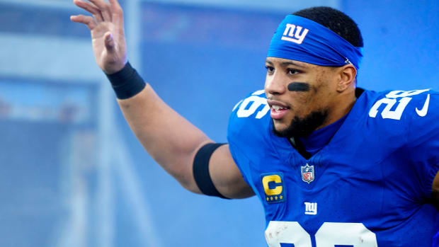 New York Giants running back Saquon Barkley (26) takes the field at MetLife Stadium, Sunday, January 7, 2024.
